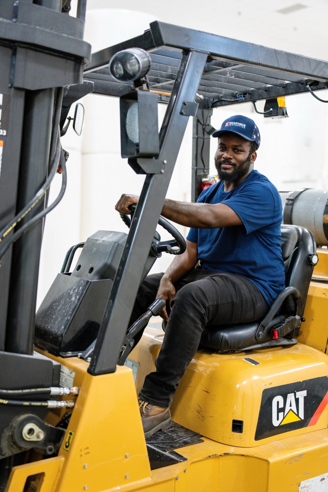 Employee operating a forklift inside the Texas Tissue warehouse