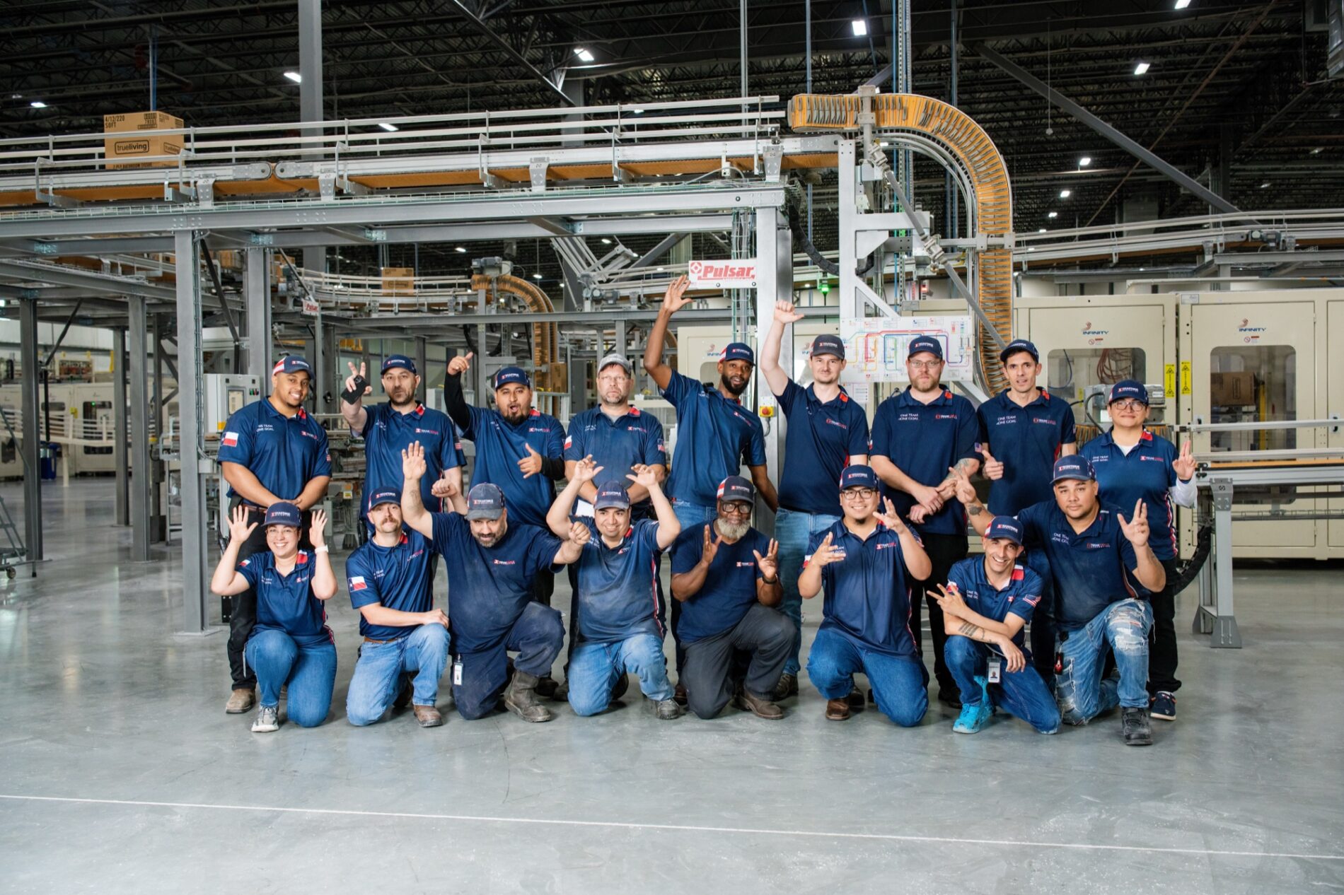 Texas Tissue team posing together in the production plant